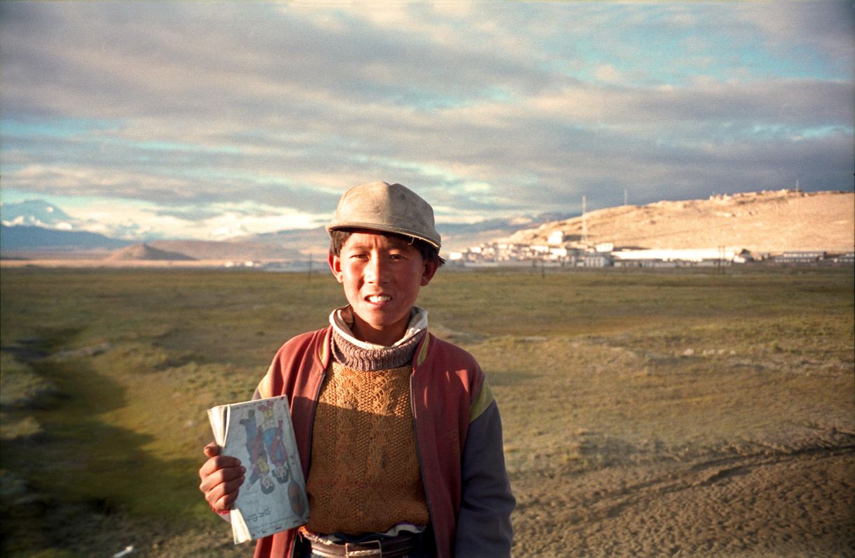 18 A Local Boy Carries His Books On His Way To School In Tingri